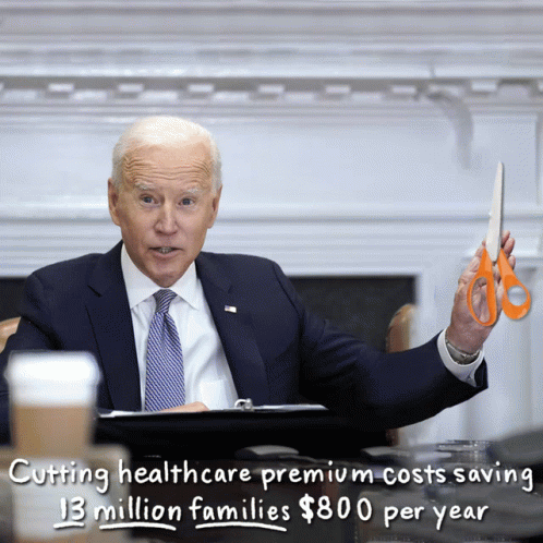 Man In Suit Holding Scissors GIF