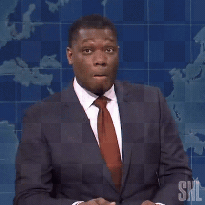 A Man In A Suit And Tie Is Holding A Pencil And Saying Maybe GIF