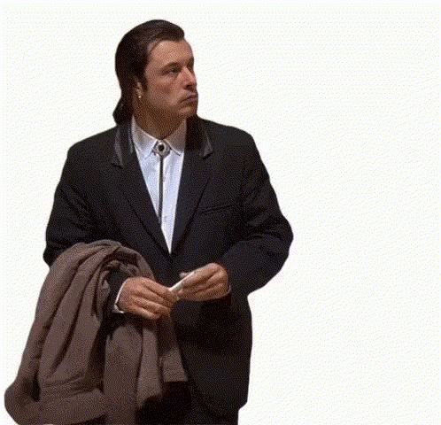 A Man In A Suit And Tie Is Holding A Piece Of Paper And A Jacket . GIF