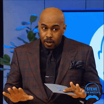 A Man In A Suit And Tie Is Holding A Piece Of Paper That Says Steve On Watch On It GIF
