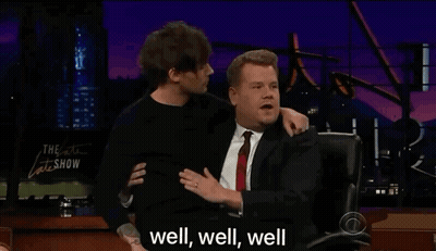 A Man In A Suit And Tie Is Hugging Another Man In A Suit And Tie . GIF