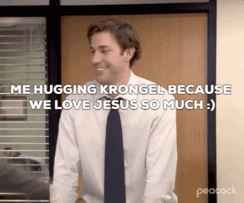 A Man In A Suit And Tie Is Hugging Krongel Because We Love Jesus So Much . GIF