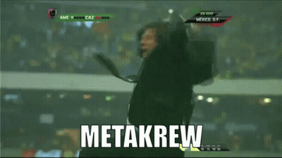 A Man In A Suit And Tie Is Jumping In The Air With The Word Metakrew Written In White GIF
