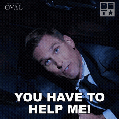 A Man In A Suit And Tie Is Laying Down With The Words You Have To Help Me GIF