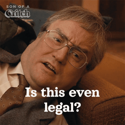 A Man In A Suit And Tie Is Laying On A Couch And The Caption Says " Is This Even Legal " GIF