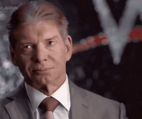 A Man In A Suit And Tie Is Looking At The Camera With A Lastride Logo In The Background GIF