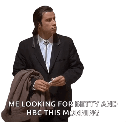 A Man In A Suit And Tie Is Looking For Betty And Hbc GIF
