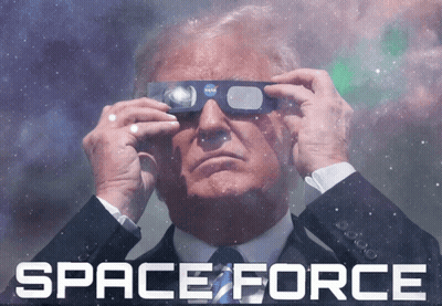 A Man In A Suit And Tie Is Looking Through A Pair Of Nasa Glasses With The Words Space Force Behind Him GIF