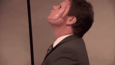 A Man In A Suit And Tie Is Looking Up GIF
