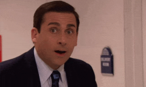 Man In Suit Making Funny Face GIF