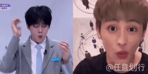 A Man In A Suit And Tie Is Making A Funny Face And Another Man Is Making A Funny Face . GIF