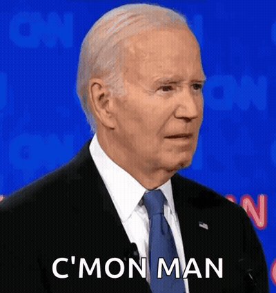 A Man In A Suit And Tie Is Making A Funny Face And Saying C 'Mon Man . GIF