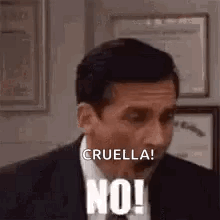 A Man In A Suit And Tie Is Making A Funny Face And Saying `` Cruella ! No ! '' GIF
