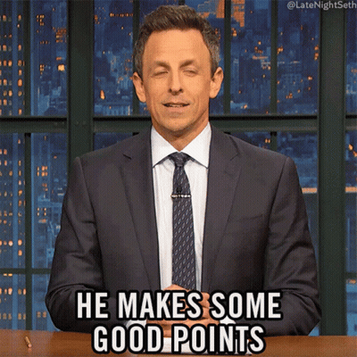 A Man In A Suit And Tie Is Making A Funny Face And Saying He Makes Some Good Points GIF