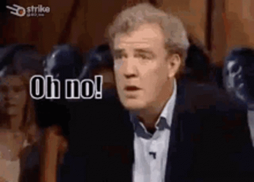 A Man In A Suit And Tie Is Making A Funny Face And Saying `` Oh No ! '' GIF