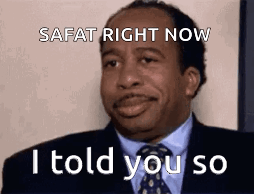 A Man In A Suit And Tie Is Making A Funny Face And Saying Safat Right Now I Told You So . GIF