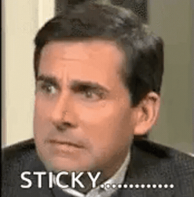 A Man In A Suit And Tie Is Making A Funny Face And Saying Sticky . GIF