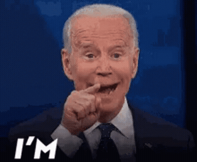 A Man In A Suit And Tie Is Making A Funny Face And Says I 'M GIF