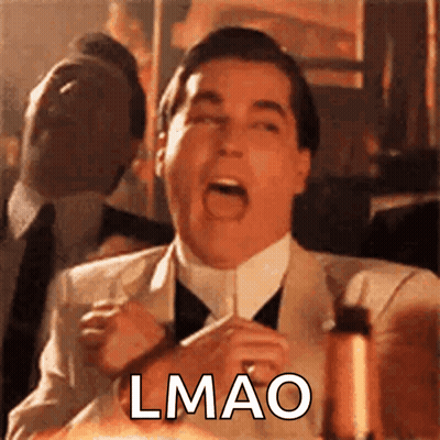 A Man In A Suit And Tie Is Making A Funny Face And The Word Lmao Is On The Bottom GIF