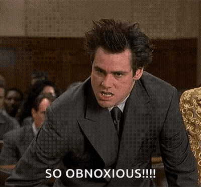 A Man In A Suit And Tie Is Making A Funny Face In Front Of A Crowd While Saying So Obnoxious . GIF