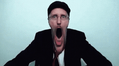 A Man In A Suit And Tie Is Making A Funny Face With His Mouth Open GIF