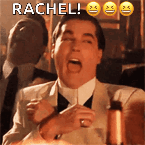 A Man In A Suit And Tie Is Making A Funny Face With The Name Rachel Written Above Him GIF