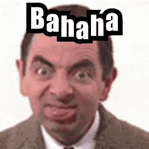 A Man In A Suit And Tie Is Making A Funny Face With The Word Banana On His Head . GIF