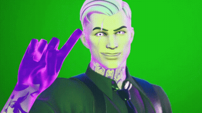 A Man In A Suit And Tie Is Making A Peace Sign GIF