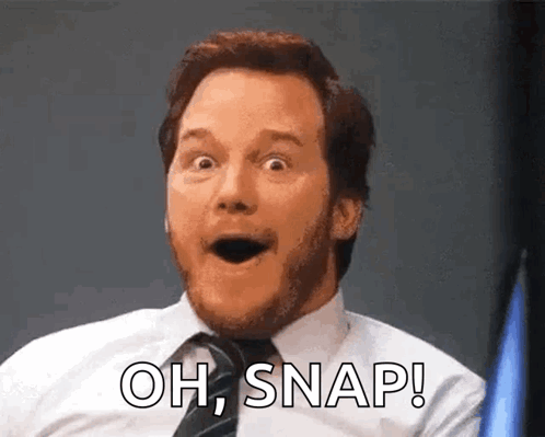 A Man In A Suit And Tie Is Making A Surprised Face And Saying `` Oh , Snap ! '' GIF