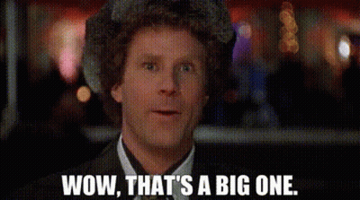 A Man In A Suit And Tie Is Making A Surprised Face And Saying `` Wow , That 'S A Big One . GIF