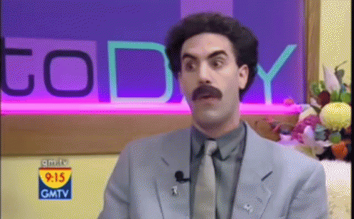 A Man In A Suit And Tie Is On Gmtv GIF
