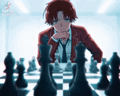 A Man In A Suit And Tie Is Playing A Game Of Chess . GIF