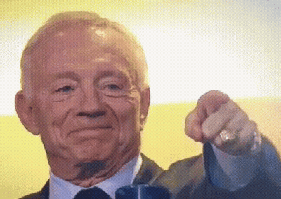 A Man In A Suit And Tie Is Pointing At The Camera With His Finger GIF