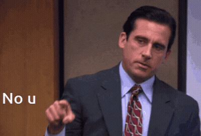 A Man In A Suit And Tie Is Pointing At The Camera With The Word No U Behind Him GIF