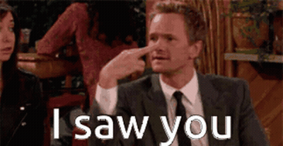 A Man In A Suit And Tie Is Pointing His Finger At His Nose And Says I Saw You GIF