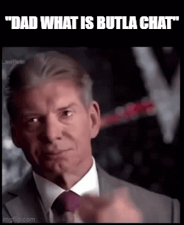 A Man In A Suit And Tie Is Pointing His Finger At The Camera . GIF