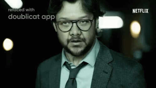 A Man In A Suit And Tie Is Refaced With A Doublecat App . GIF