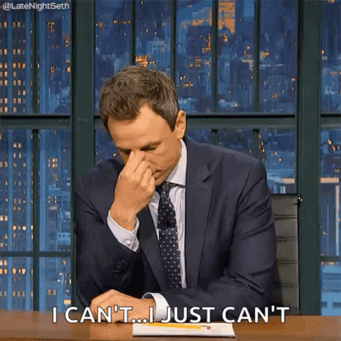 A Man In A Suit And Tie Is Rubbing His Nose And Says I Can 'T ... I Just Can 'T .. GIF