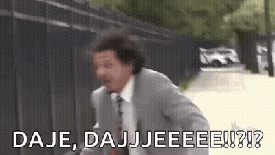 A Man In A Suit And Tie Is Running Down A Street With The Words `` Daje , Dajjeee !! '' . GIF