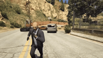 A Man In A Suit And Tie Is Running Down The Road GIF