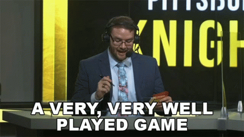 A Man In A Suit And Tie Is Saying A Very Very Well Played Game GIF