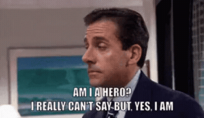 A Man In A Suit And Tie Is Saying `` Am I A Hero ? `` GIF