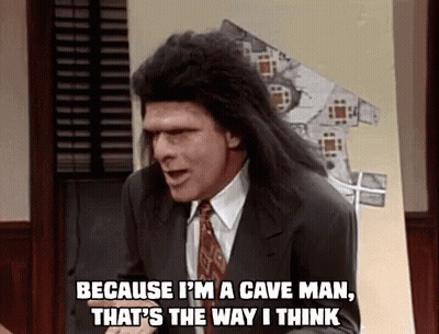 A Man In A Suit And Tie Is Saying `` Because I 'M A Cave Man That 'S The Way I Think '' GIF