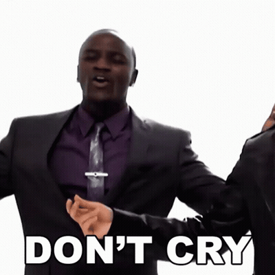 A Man In A Suit And Tie Is Saying " Don 'T Cry " GIF