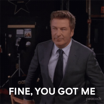 A Man In A Suit And Tie Is Saying " Fine You Got Me " GIF