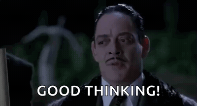 A Man In A Suit And Tie Is Saying `` Good Thinking '' In A Movie . GIF