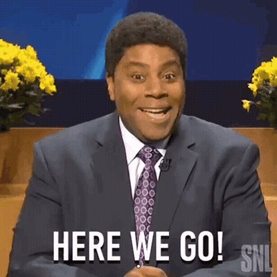 A Man In A Suit And Tie Is Saying Here We Go GIF