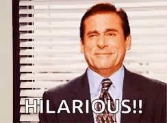 A Man In A Suit And Tie Is Saying Hilarious . GIF