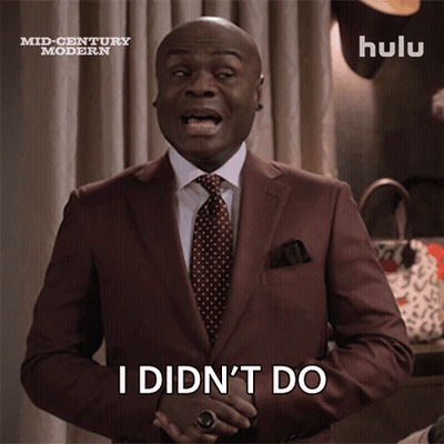 A Man In A Suit And Tie Is Saying " I Did N't Do Anything " GIF