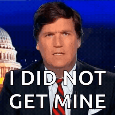 A Man In A Suit And Tie Is Saying `` I Did Not Get Mine '' While Standing In Front Of The Capitol Building . GIF